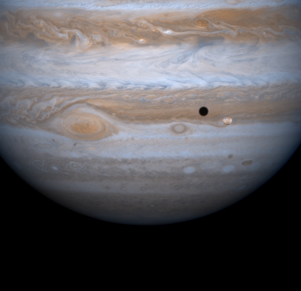 Jupiter, it's moon Io, and Io's shadow (Cassini mission flyby, 2000)